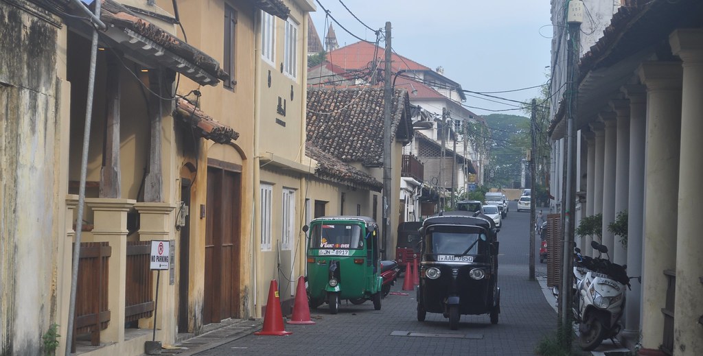 Colonial shopfronts and tuk-tuks on Pedlar Street