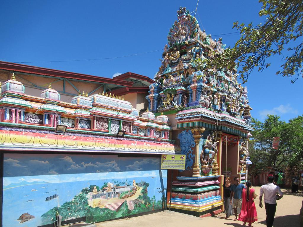 Painted gopuram and devotees at Koneswaram